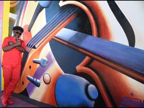 Junior Moore Explores Art With ‘Broken Pieces’ - Tamlins Member Pays Homage To Reggae’s ‘Fallen Soldiers’ In Water Lane Mural | The Gleaner